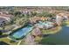 Aerial view of a community featuring tennis courts, pool and resident buildings at 417 Pavia Loop, Lake Mary, FL 32746