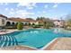 Resort-style pool with plenty of seating areas and lush landscaping, creating a relaxing atmosphere at 417 Pavia Loop, Lake Mary, FL 32746