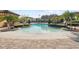 Zero entry resort style pool with plenty of seating areas and lush landscaping at 417 Pavia Loop, Lake Mary, FL 32746