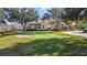 Community Putting green with sand trap and views of the clubhouse at 417 Pavia Loop, Lake Mary, FL 32746