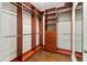 Spacious walk-in closet with custom shelving and drawers for organized storage at 417 Pavia Loop, Lake Mary, FL 32746