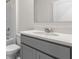 Modern bathroom with gray vanity and a quartz countertop at 4229 Singing Mockingbird Blvd, Bartow, FL 33830