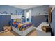 bedroom with a full-size bed and nautical theme at 4233 Singing Mockingbird Blvd, Bartow, FL 33830