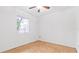 Simple bedroom with tiled floor and large window at 4401 Santee St, Orlando, FL 32804