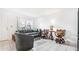 Living room with gray couches, dark wood chairs, and tiled floors at 4401 Santee St, Orlando, FL 32804