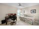 Bedroom with a daybed, workspace, and ceiling fan at 4818 Breezy Palms Ct, Windermere, FL 34786