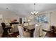 Dining area with hardwood floors and a chandelier at 4818 Breezy Palms Ct, Windermere, FL 34786