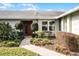 Inviting front entrance with landscaping and walkway at 4818 Breezy Palms Ct, Windermere, FL 34786