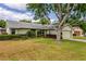 Charming home with a well-maintained lawn and landscaping at 4818 Breezy Palms Ct, Windermere, FL 34786