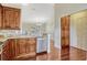 Open kitchen features wooden cabinetry, granite countertops and stainless steel appliances at 4818 Breezy Palms Ct, Windermere, FL 34786