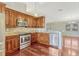 Bright kitchen features wooden cabinets, granite counters, stainless appliances, and breakfast bar at 4818 Breezy Palms Ct, Windermere, FL 34786