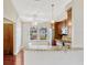 Open kitchen with granite countertop, stainless steel appliances and natural light at 4818 Breezy Palms Ct, Windermere, FL 34786