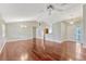 Bright living room with hardwood floors, open layout, ceiling fan, and natural lighting at 4818 Breezy Palms Ct, Windermere, FL 34786