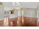 Open-concept living room boasts hardwood floors, a breakfast bar, and lots of natural light at 4818 Breezy Palms Ct, Windermere, FL 34786