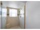 Large walk-in shower with glass enclosure and built-in seat at 4818 Breezy Palms Ct, Windermere, FL 34786