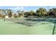 Well-maintained tennis courts in a sunny area at 4818 Breezy Palms Ct, Windermere, FL 34786