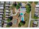 Aerial view of community features including pools, shuffleboard, and clubhouse at 50989 Highway 27 # 25, Davenport, FL 33897