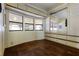 Bedroom with built-in mirrored wardrobe and dark brown tile floor at 50989 Highway 27 # 25, Davenport, FL 33897