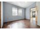 Bright bedroom with two windows and dark brown tile flooring at 50989 Highway 27 # 25, Davenport, FL 33897