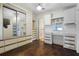 Spacious bedroom with mirrored closet doors and built-in drawers at 50989 Highway 27 # 25, Davenport, FL 33897