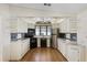 Kitchen features black appliances and light-colored cabinetry at 50989 Highway 27 # 25, Davenport, FL 33897