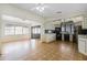 Galley kitchen with black appliances and light wood cabinets at 50989 Highway 27 # 25, Davenport, FL 33897