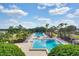 Two sparkling community pools surrounded by lush landscaping at 50989 Highway 27 # 25, Davenport, FL 33897