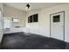 Bright sunroom with multiple windows and grey carpet at 50989 Highway 27 # 25, Davenport, FL 33897