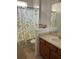 Bathroom with shower/tub combo and lemon-print curtain at 538 Bexley Dr, Davenport, FL 33897