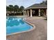 Community pool with covered patio and seating at 538 Bexley Dr, Davenport, FL 33897