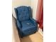 Blue fabric recliner chair in bedroom at 538 Bexley Dr, Davenport, FL 33897