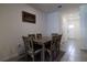 Dining area with a wooden table and chairs, view of kitchen at 54 Bella Oaks Dr, Port Orange, FL 32129