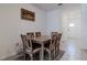 Dining area with a wooden table and chairs, view of kitchen at 54 Bella Oaks Dr, Port Orange, FL 32129