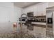 Kitchen with granite countertop and stainless steel sink at 54 Bella Oaks Dr, Port Orange, FL 32129