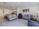 Open living room with view into the kitchen and patio at 54 Bella Oaks Dr, Port Orange, FL 32129