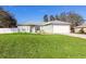 House with attached garage and expansive lawn at 652 Mountain Way Ave, Deltona, FL 32738