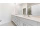 Bright bathroom with double vanity and shower at 738 Lemon Ave, Fruitland Park, FL 34731