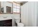 Clean bathroom with shower/tub combo and dark wood vanity at 798 Saint Johns River Dr, Sanford, FL 32773