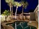 Night view of a pool and surrounding landscaping with string lights at 798 Saint Johns River Dr, Sanford, FL 32773