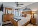 Bright bedroom with wood bed frame and dresser at 826 Seneca Trl, St Cloud, FL 34772