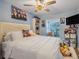 Cozy bedroom with double bed, built in shelving and large window at 826 Seneca Trl, St Cloud, FL 34772