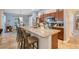 Kitchen island with granite countertop and seating at 826 Seneca Trl, St Cloud, FL 34772