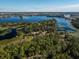 Expansive aerial view of a lakefront property and community at 9229 Lake Hickory Nut Dr, Winter Garden, FL 34787