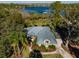 Lakefront home with metal roof and nicely landscaped yard at 9229 Lake Hickory Nut Dr, Winter Garden, FL 34787