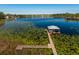 Aerial view of a lakefront dock with boathouse at 9229 Lake Hickory Nut Dr, Winter Garden, FL 34787