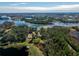 Aerial view showcasing a lakefront home and surrounding area at 9229 Lake Hickory Nut Dr, Winter Garden, FL 34787