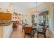 Kitchen breakfast nook with a glass-top table and wicker chairs at 9229 Lake Hickory Nut Dr, Winter Garden, FL 34787