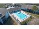 Community pool with lounge chairs at 951 Courtyard Ln # 22, Orlando, FL 32825