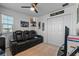 Bedroom showcasing a comfortable reclining sofa, closet space and media at 958 Anna Pl, Davenport, FL 33837