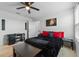 Cozy bedroom features a plush black coverlet, decorative pillows and a work area for the resident at 958 Anna Pl, Davenport, FL 33837